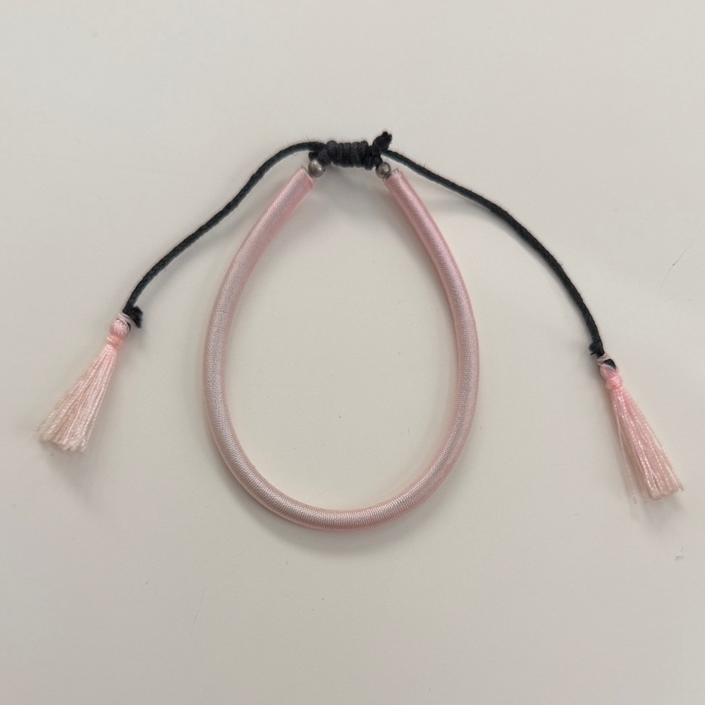 Elegant Pink Bracelet with Tassels